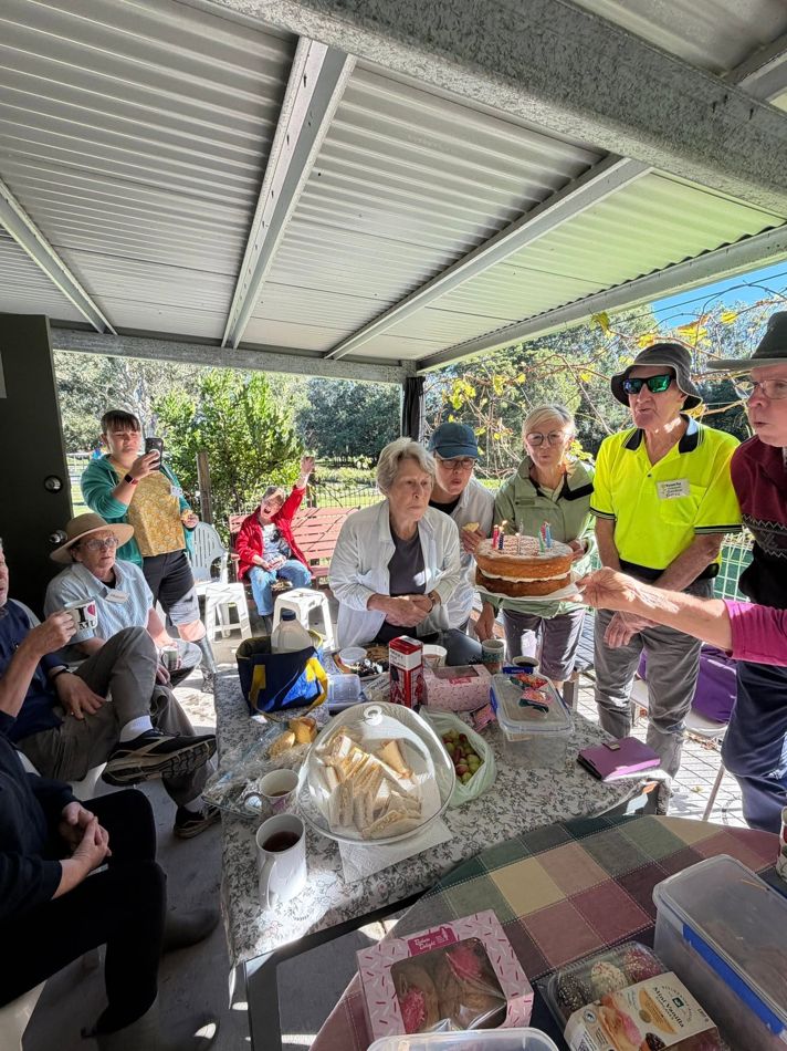 Members sharing morning tea on the patio
